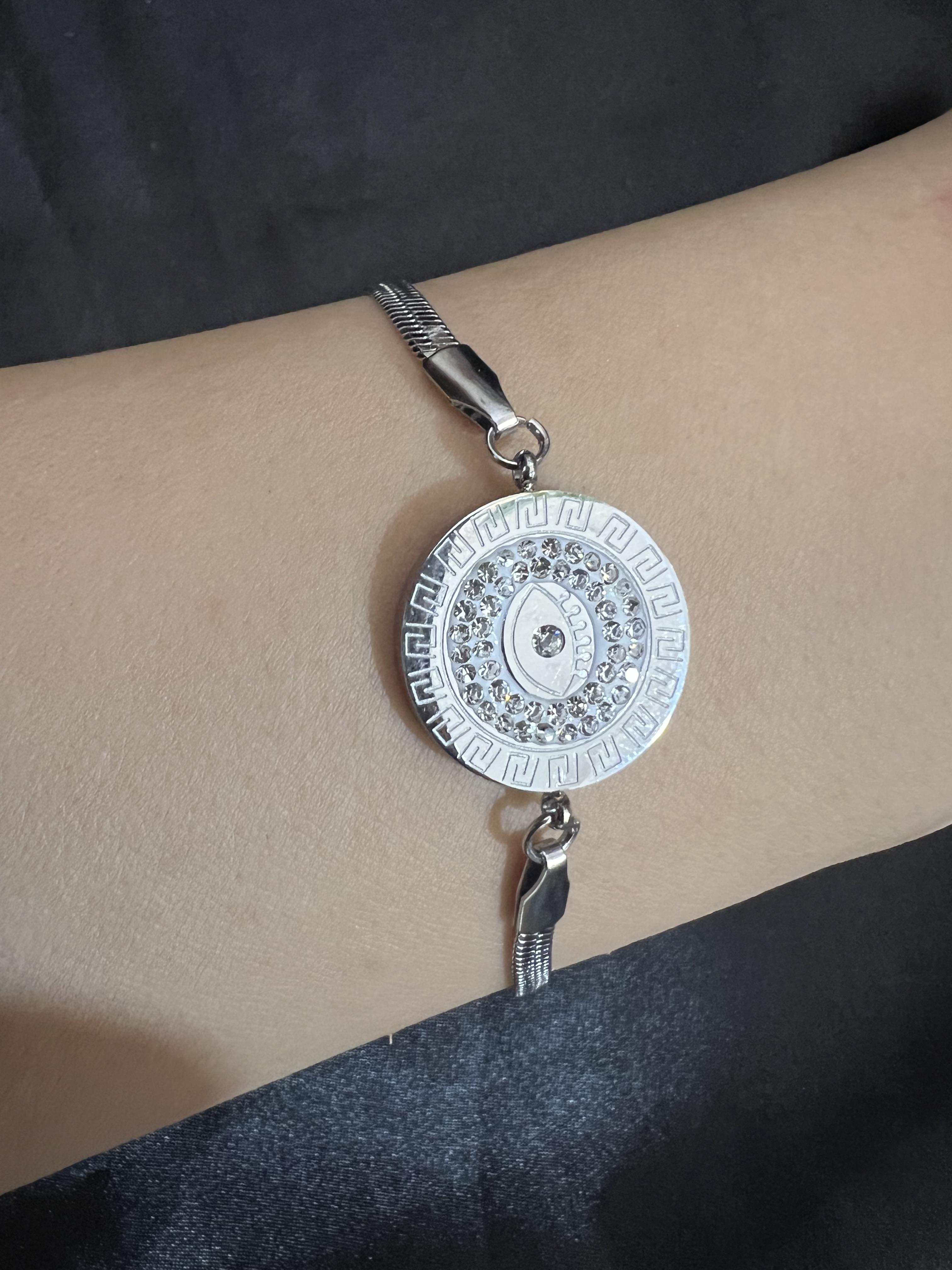 İçi taşlı göz model gümüş renk çelik bileklik