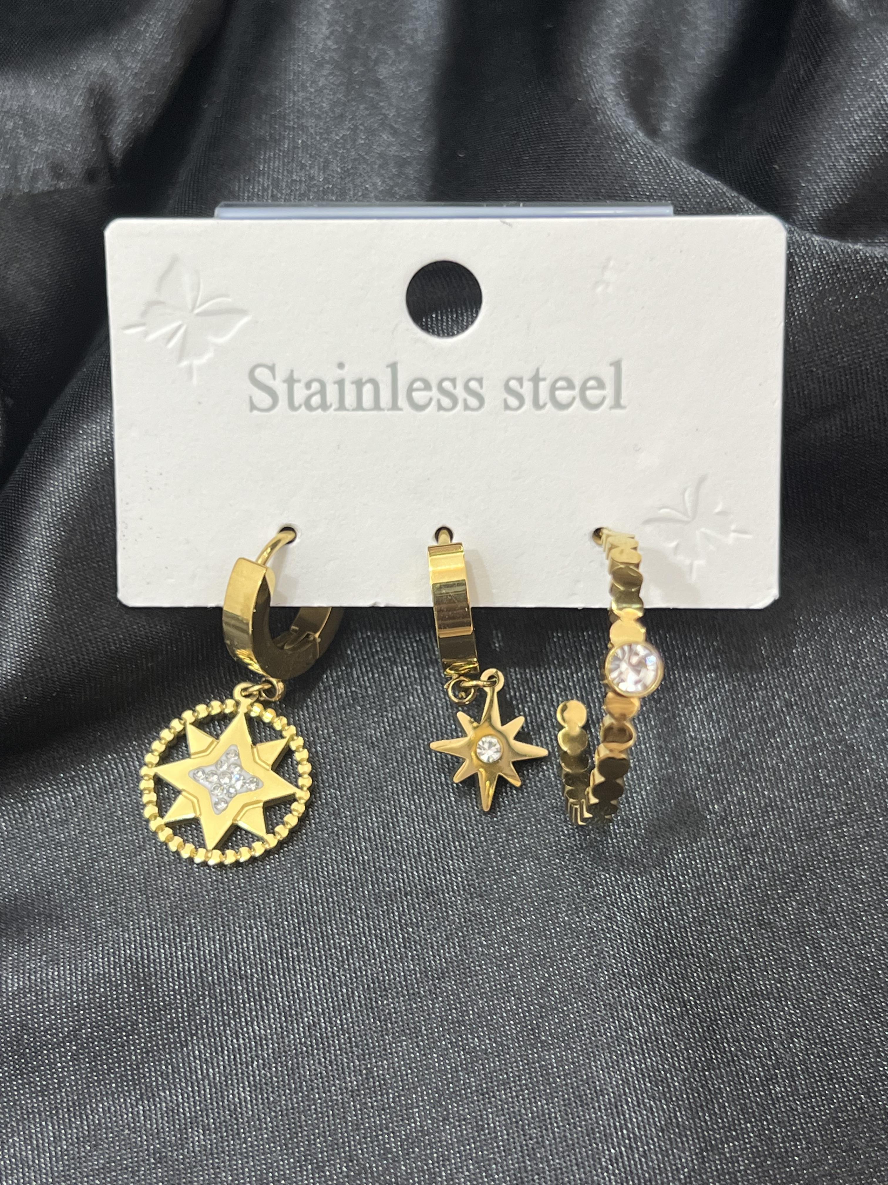 Üçlü taş detay kutup yıldızı model gold çelik küpe