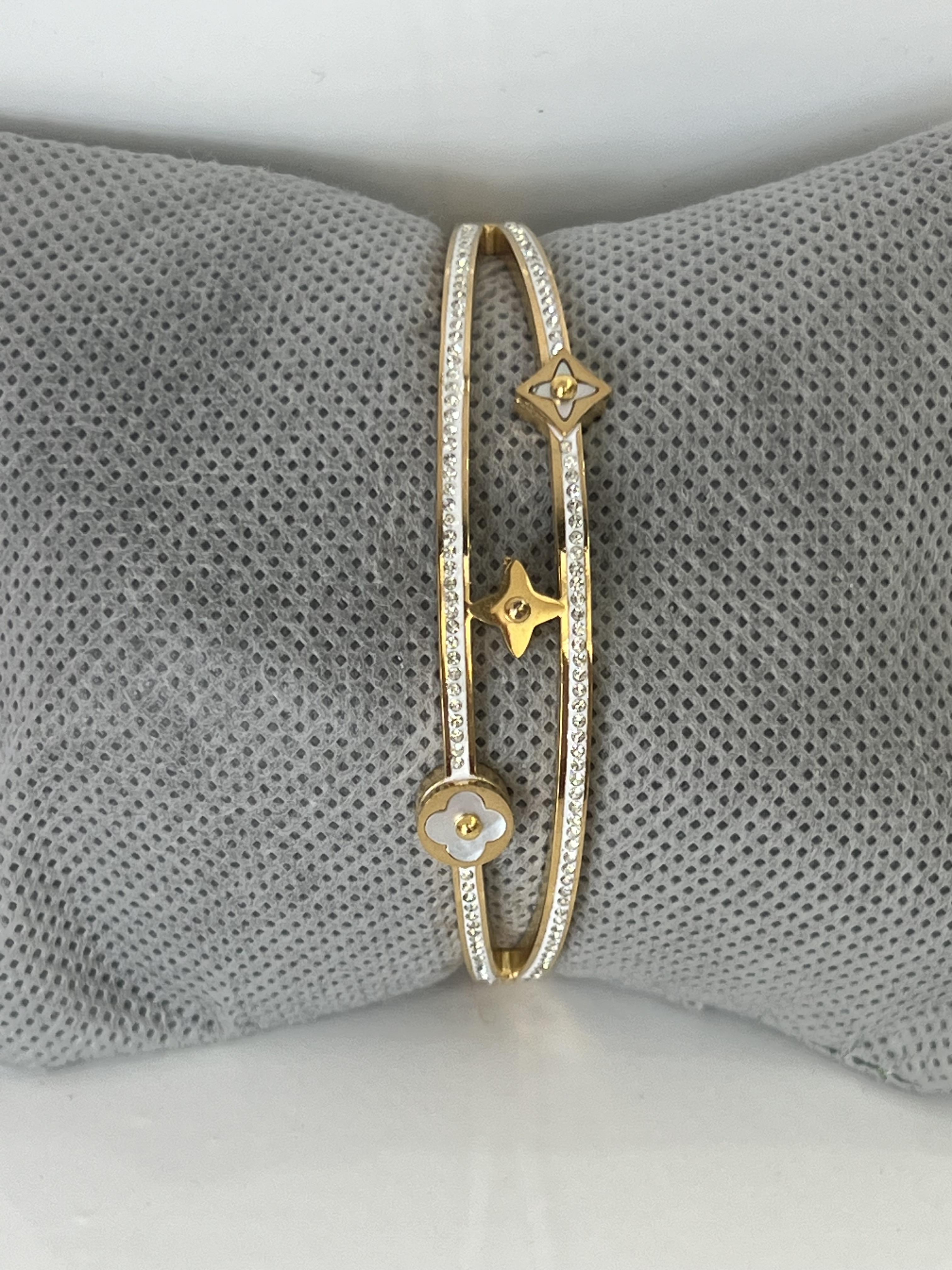 Yonca ve kutup yıldızı model gold kelepçe